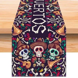 Detailed view of Day of the Dead table runner with sugar skull and guitar patterns