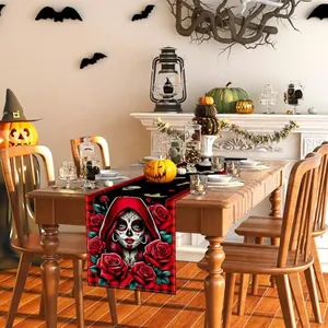 Detail of Day of the Dead table runner with sugar skull and red rose pattern.