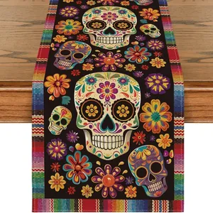 Detailed view of Mexican Day of the Dead table runner with sugar skull and colorful floral patterns