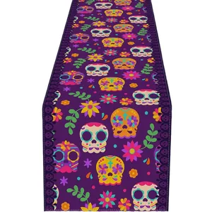 Purple Mexican Day of the Dead table runner with vibrant sugar skull and flower prints