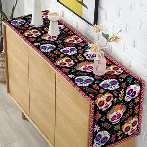 Detailed pattern view of a Day of the Dead table runner with vibrant sugar skulls.