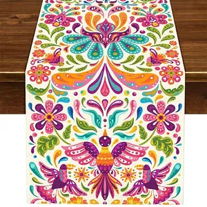 Detailed view of Mexican Bohemian linen table runner with colorful floral and bird pattern