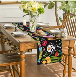 Detail of Mexican Day of the Dead table runner with colorful skull and floral patterns