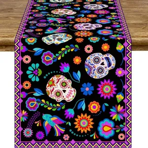 Detailed macro view of Day of the Dead table runner featuring sugar skulls and flowers