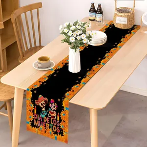 Day of the Dead table runner with skeleton and marigold flower print on wooden table