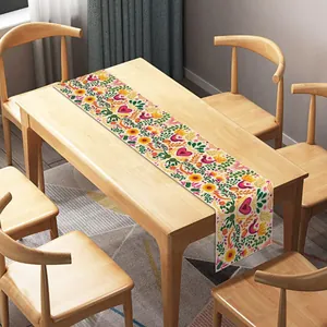 Vibrant Mexican Day of the Dead table runner featuring floral and sugar skull folk art patterns
