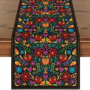 Vibrant Mexican folk art floral pattern on a durable linen table runner detail view.