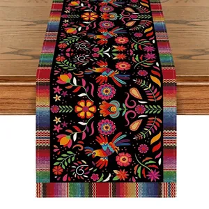 Macro detail of Mexican Bohemian linen table runner with vibrant floral and bird patterns