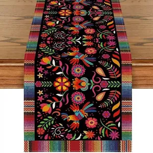 Detailed view of Mexican Day of the Dead table runner with floral bird patterns