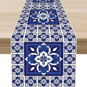 Detailed macro view of Mexican Bohemian style table runner with intricate blue tile patterns