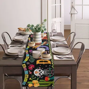 Linen table runner with Day of the Dead patterns for Mexican holiday party dining decor