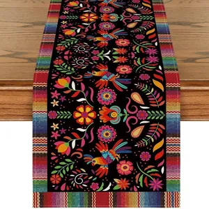 Detailed Mexican Day of the Dead table runner with vibrant floral and bird patterns.