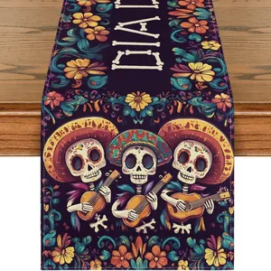 Detail of Day of the Dead table runner featuring guitar-playing skeletons and flowers