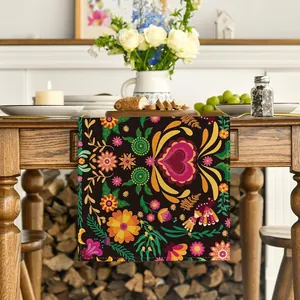 Detailed view of Mexican Day of the Dead table runner with vibrant floral patterns