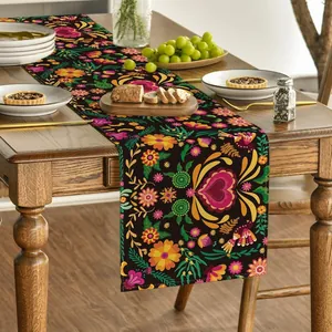 Detailed view of a Mexican floral table runner with colorful Otomi-style patterns.