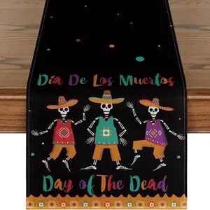 Detailed view of linen table runner for Day of the Dead with dancing skeletons