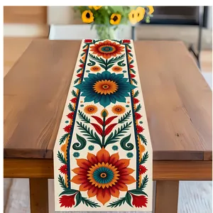 Mexikanischer Tischläufer mit floralem Muster in Orange und Blau auf dem Holztisch