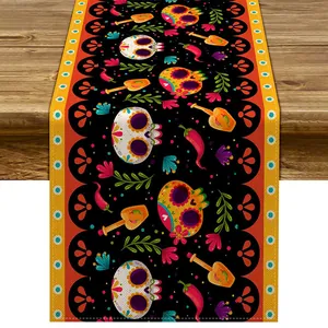 Vibrant Mexican Day of the Dead table runner with sugar skull and chili pepper patterns