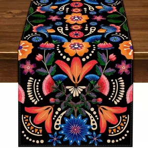 Mexican Day of the Dead floral table runner with colorful folk art pattern on black linen