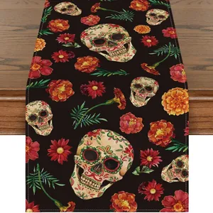 Detailed view of linen table runner with colorful sugar skull and marigold flower prints