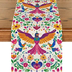 Vibrant Mexican Otomi table runner with colorful bird and floral patterns for carnival.