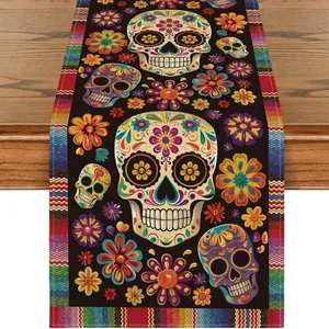 Vibrant sugar skull and floral patterns on black Mexican Day of the Dead themed table runner