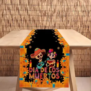 Camino de mesa festivo del Día de los Muertos con calaveras de azúcar y cempasúchil
