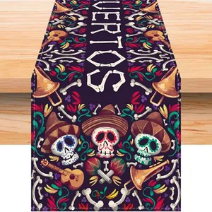 Festive linen table runner featuring Mexican Day of the Dead skull and floral prints