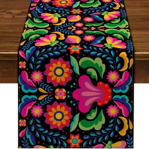 Vibrant Mexican Day of the Dead table runner with colorful floral pattern on black