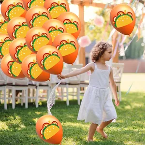 Festive Cinco de Mayo orange latex balloons with taco prints for outdoor party decor