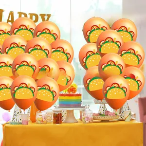 Festive orange balloons with taco print displayed in a colorful birthday party scene