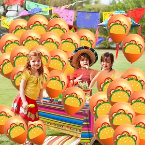 Mexican Cinco de Mayo party decoration with orange taco printed balloons and kids