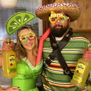 Lively Mexican carnival party celebration scene with festive costumes and themed decor