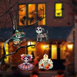 Mexican Day of the Dead wooden ornaments hanging from a branch in a festive night scene