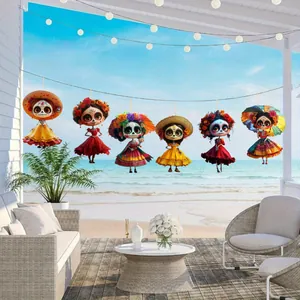 Detailed view of six colorful wooden Day of the Dead skull doll ornaments hanging outdoors.