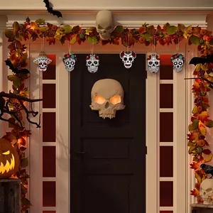 Detailed view of colorful wooden sugar skull hanging ornaments on a festive Halloween door