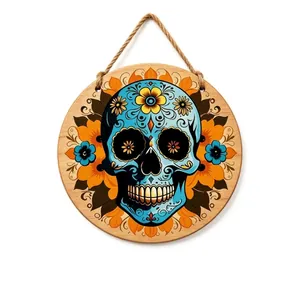 Round wooden Day of the Dead door sign with vibrant sugar skull and flower designs.
