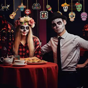Detailed view of colorful Day of the Dead wooden skull pendants hanging in a festive party room