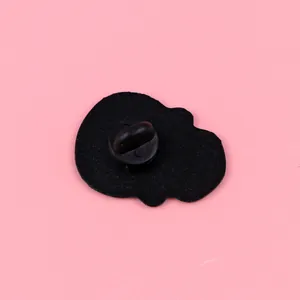 Detailed macro back view of a punk skull enamel pin featuring a black rubber clutch