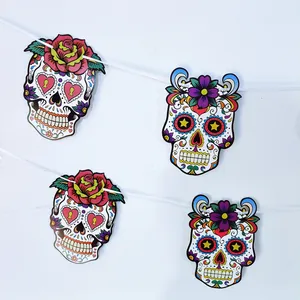 Detailed view of colorful Mexican Day of the Dead sugar skull garland banner decorations
