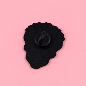 Detailed back view of a black metal rose skull enamel pin with a durable rubber clutch