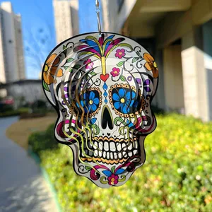 Detailed macro view of a colorful 3D stainless steel sugar skull mandala wind spinner.