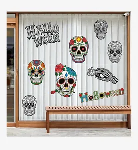 Detailed view of colorful Halloween sugar skull and text stickers on glass window
