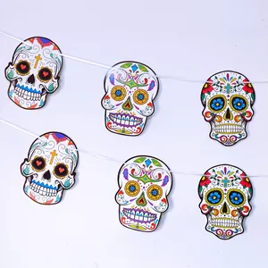 A detailed view of colorful Day of the Dead sugar skull banner garland for party decoration.