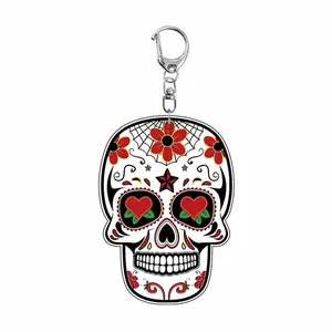 Close-up detail of a colorful Sugar Skull acrylic keychain featuring vibrant red heart eyes