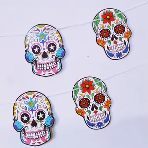 Colorful Mexican Day of the Dead sugar skull paper banners for festive party decorations.