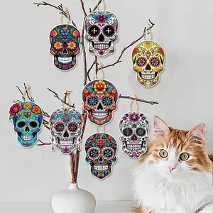 Set of colorful Mexican Day of the Dead sugar skull wooden ornaments for party decoration