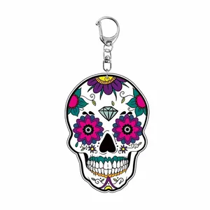 Vibrant floral sugar skull acrylic keychain with punk rock Halloween design