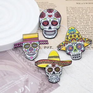 Close-up detail of four colorful Mexican Day of the Dead sugar skull enamel pins with hats