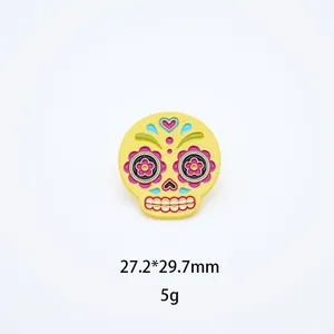 Colorful enamel sugar skull brooch with detailed Mexican Day of the Dead design
